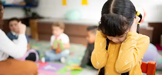 little girl experiencing sensory overload