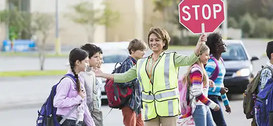 kids crossing street at crosswalk 