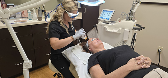 ssm health aesthetician provides facial treatment