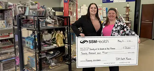 St. Vincent de Paul accepts $20K check from SSM Health