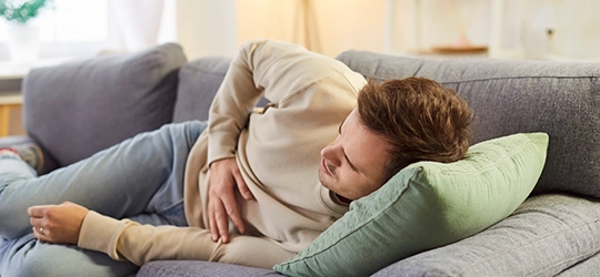 Person touching aching stomach.