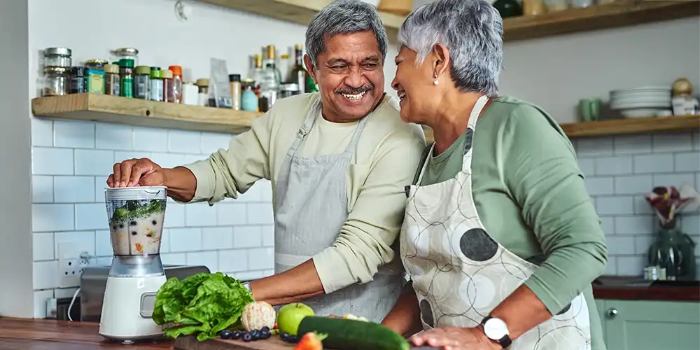 husband and wife making heart healthy meal