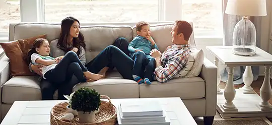 family sitting on couch