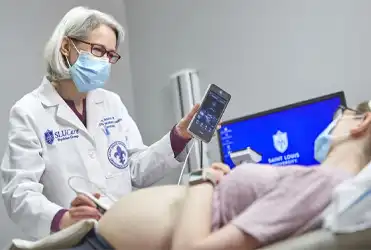 Amy Ravin, MD performing Ultrasound