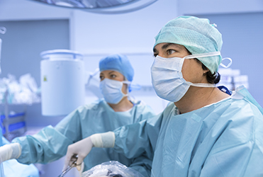 two surgeons looking at screen