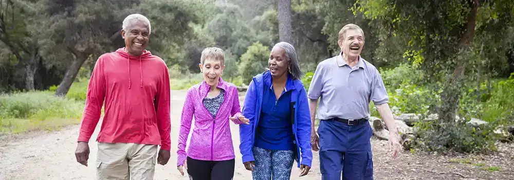 group of seniors walking in park