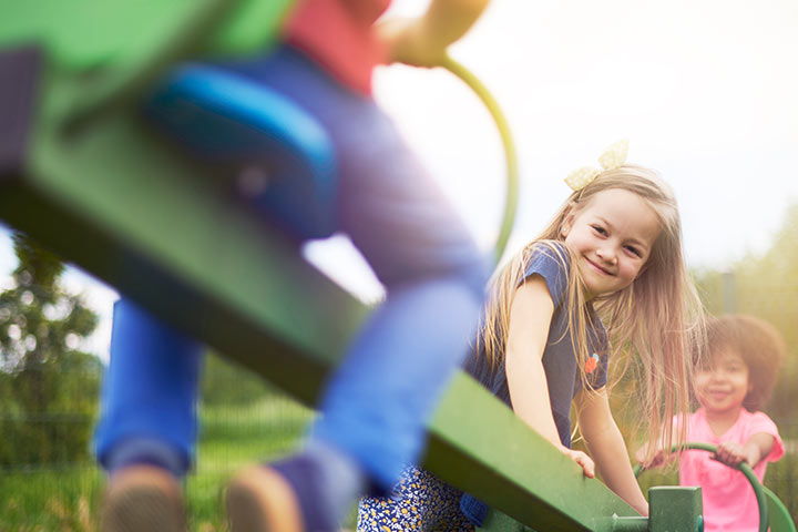 kids riding on a see saw