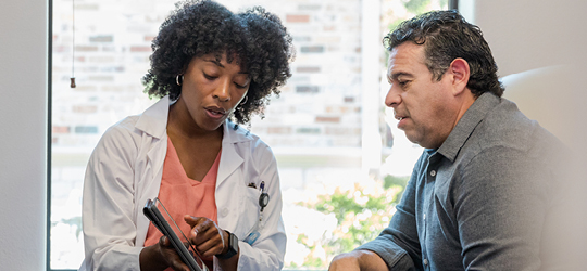 female doctor helping male patient