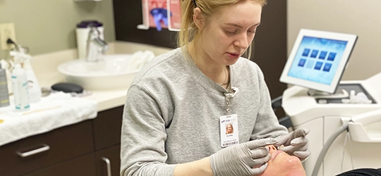 audrey hendrickson performing cosmetic services