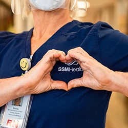 nurse holding hands over SSM health logo