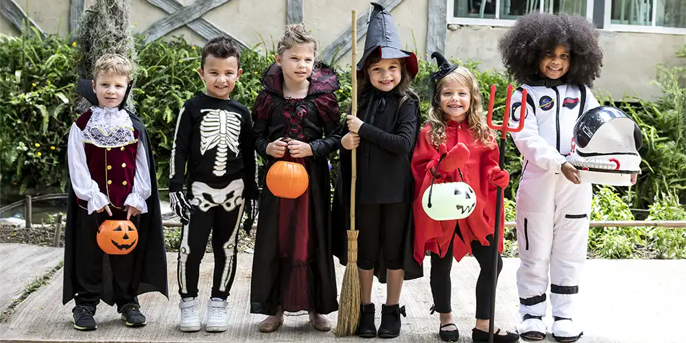group of kids wearing Halloween costumes