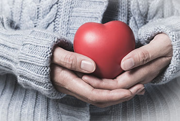 hands holding heart