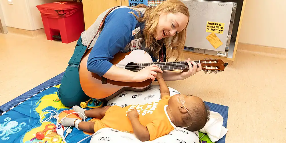 music-therapy-baby-boy-on-play-mat