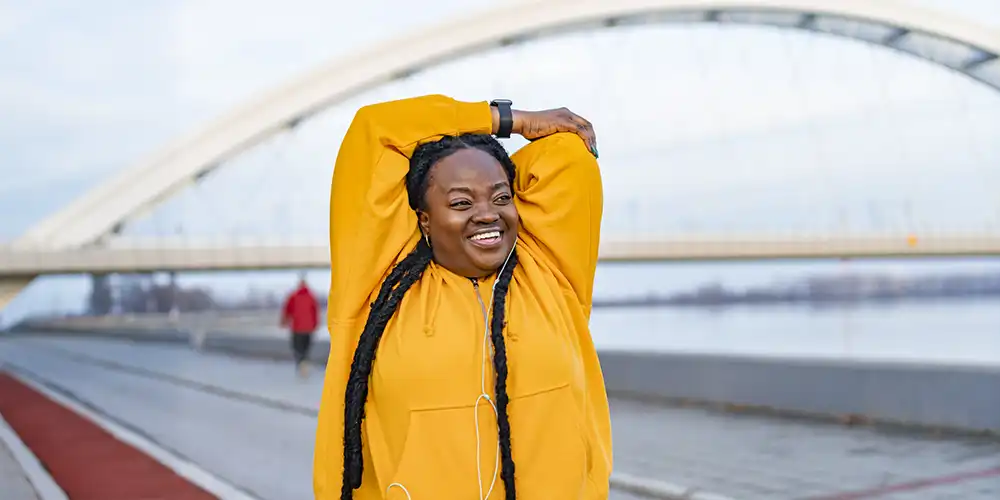 woman stretching before jog