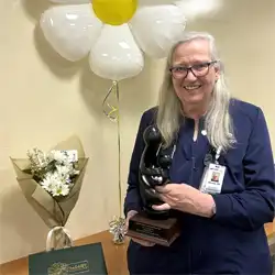 Bev Ethridge showcases her DAISY Award 