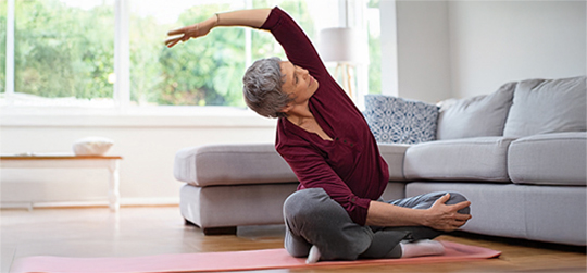 woman doing yoga at home