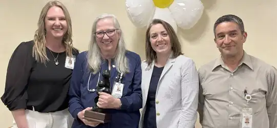 SSM Health Monroe Hospital interim VP of Patient Care Stacey Glasson, Bev Ethridge, Hospital President Chelsea Hardacre, VP of Medical Affairs Dr. John Russo.