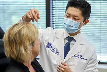 Collin Chen, MD evaluates patient