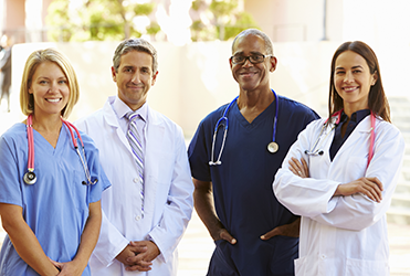 group of physicians smiling at camera