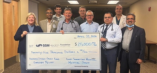 Good Samaritan Medical Group team holding 25 thousand dollar check.