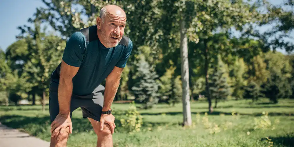 man resting during a run