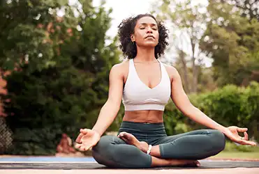woman doing yoga outside