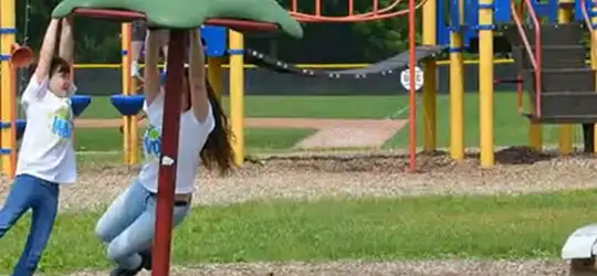 kids playing on playground at camp glow
