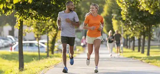 couple running on park path