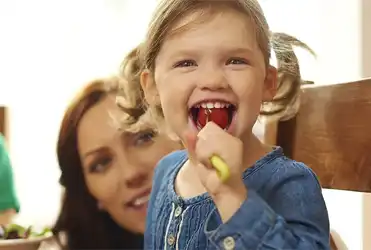 Girl eating at the dinner table
