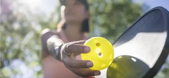 Woman playing pickleball