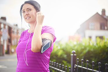 woman on walk with her ipod