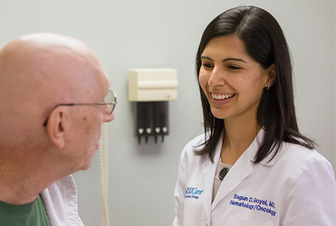 Sagun Goyal, MD speaking with patient