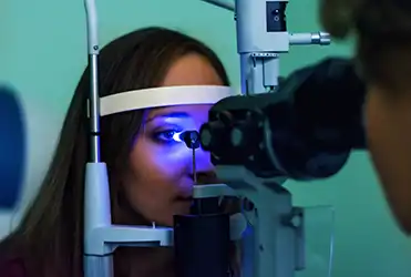 Woman getting tonometry test during eye exam