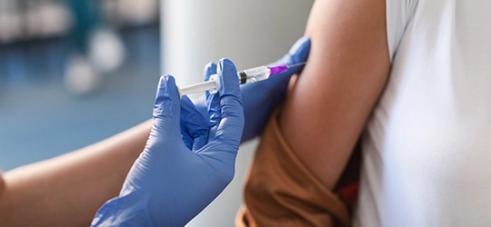 person getting measles vaccination