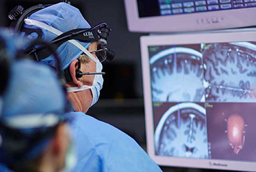 Dr. Bucholz performing deep brain stimulation on a patient