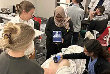 residents watching hands on lesson