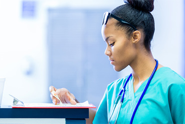 nurse checking chart notes