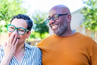 husband and wife laughing