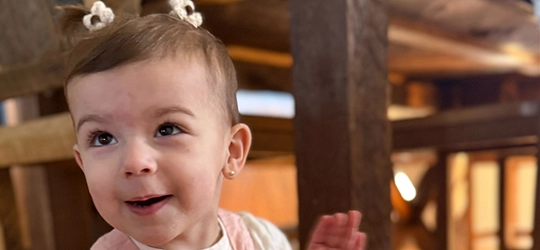 Baby Luciana smiling.