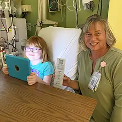cardinal glennon child life specialist reading to baby