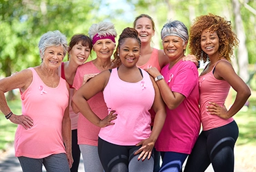 group of women wearing pink for breast cancer awareness