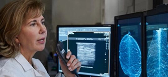 Physician analyzing imaging screen.