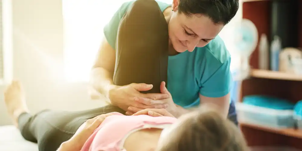 Pelvic Floor Therapist helping patient