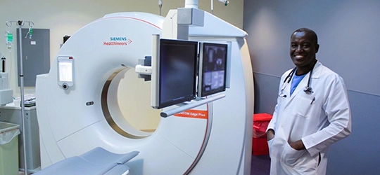 Dr. Shenje with imaging equipment.