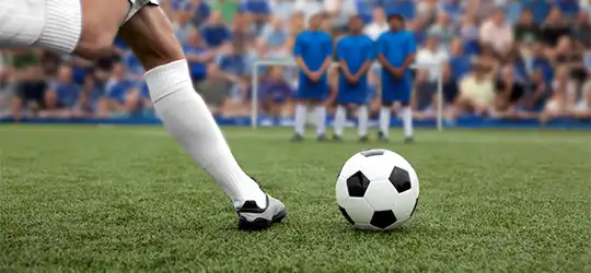 soccer player taking a penalty kick
