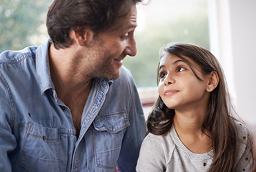 Adolescent daughter talking to father