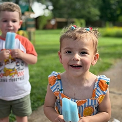 Luciana holding popsicle.