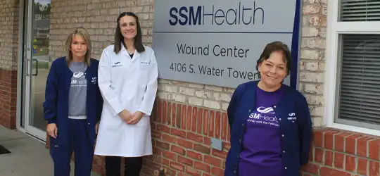 Women standing in front of building