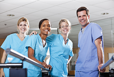 medical professionals smiling at camera