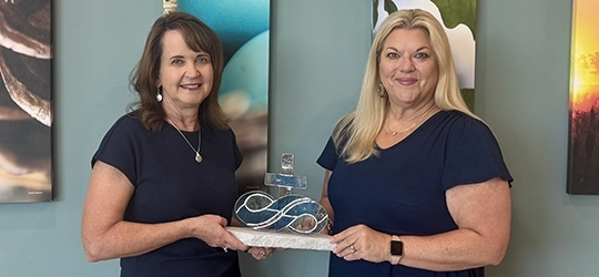 holding stained glass infinity